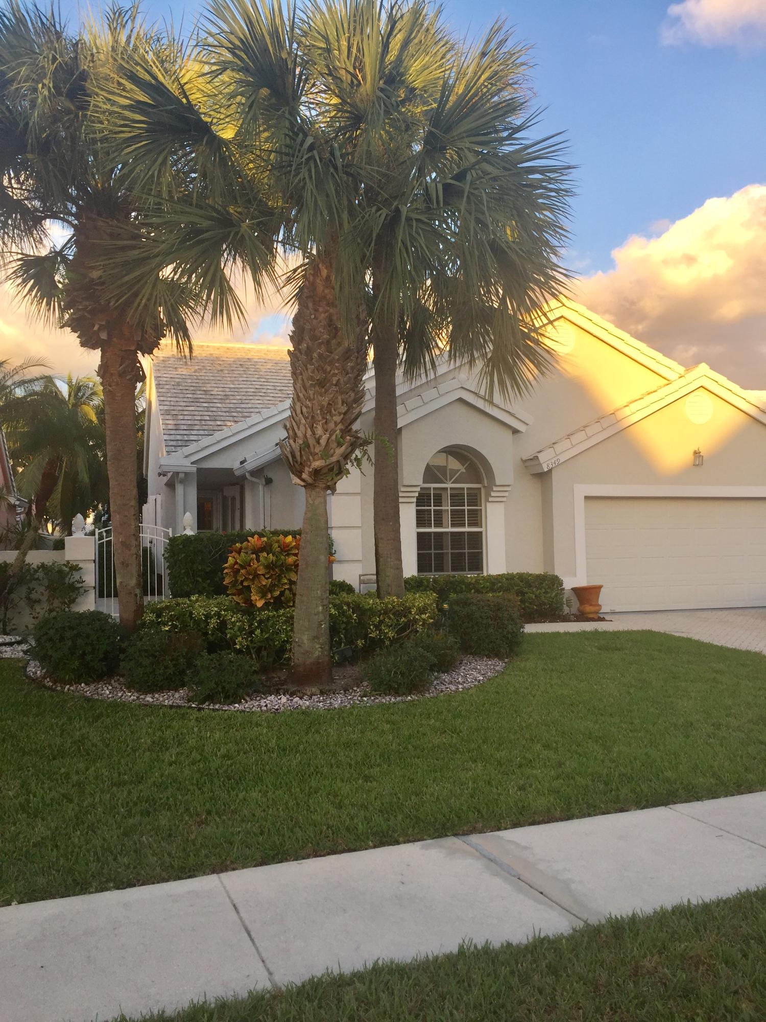 8349 Horseshoe Bay Road Boynton Beach, FL 33472 - Photo 20 of 20 a front view of a house with a garden