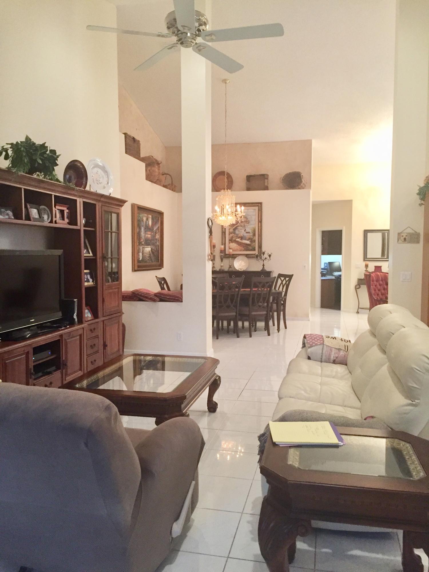 8349 Horseshoe Bay Road Boynton Beach, FL 33472 - Photo 10 of 20 a living room with furniture and a flat screen tv