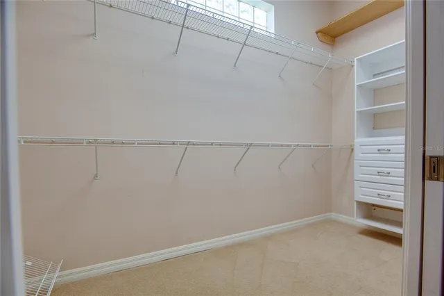 a kitchen with a stove a refrigerator and a sink