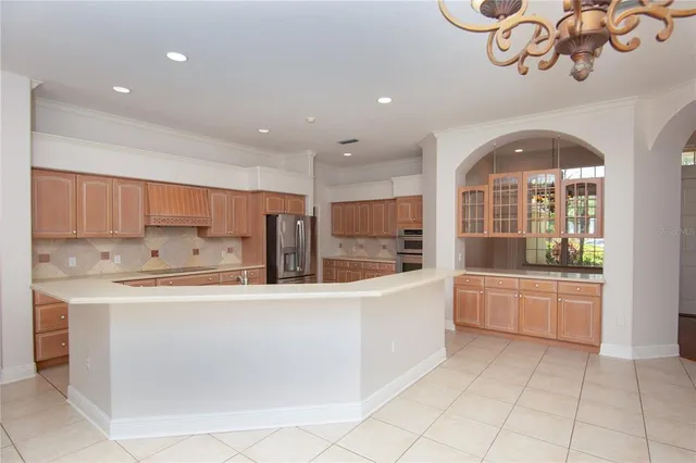 a kitchen with a sink and a large window