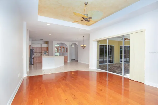 a view of a patio with a table and chairs under an umbrella