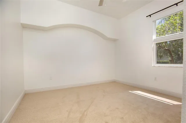 a view of empty room with windows