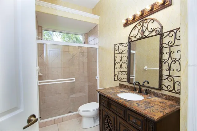 an aerial view of multiple houses with yard