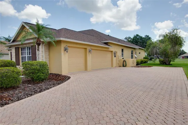 an aerial view of a house with a garden