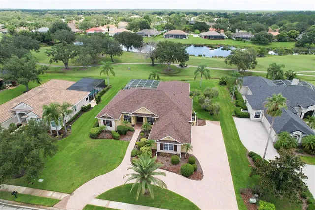 an aerial view of a house with outdoor space and street view