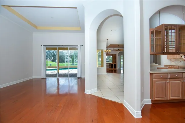 a view of a livingroom with a ceiling fan and window