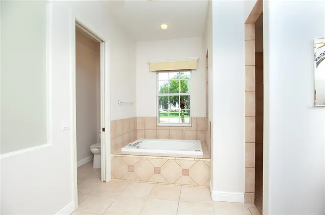 a large kitchen with a large counter top and stainless steel appliances
