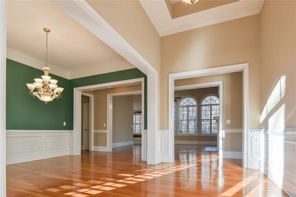 55 Glengarry Chase Covington, GA 30014 - Photo 18 of 73 a view of a livingroom with a dinning area hardwood floor a ceiling fan and window