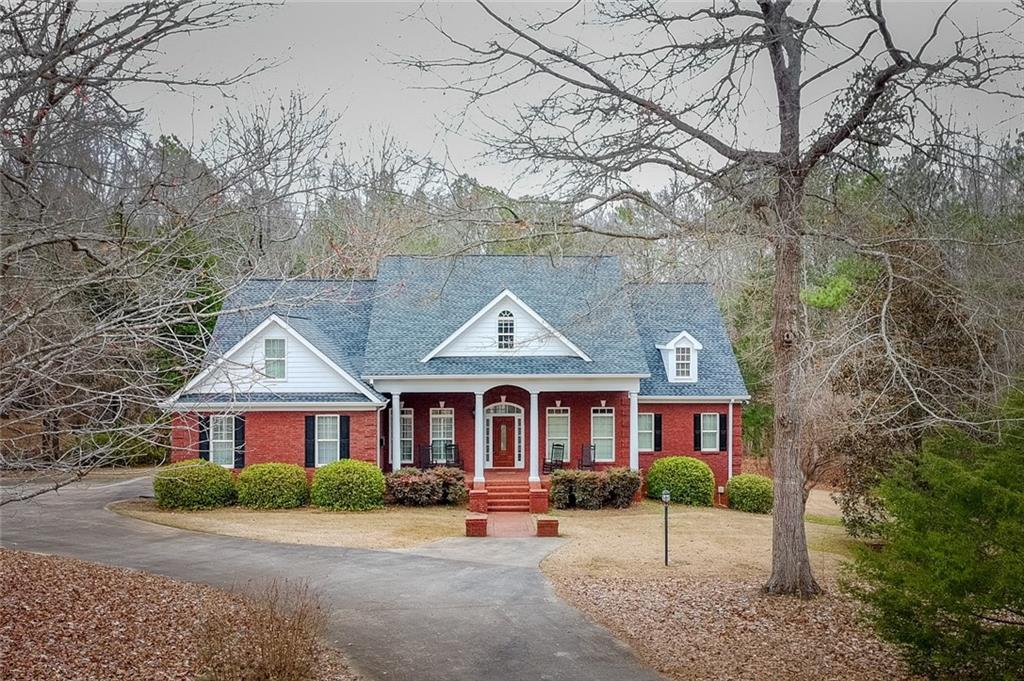 55 Glengarry Chase Covington, GA 30014 - Photo 2 of 73 a front view of a house with yard porch and sitting area