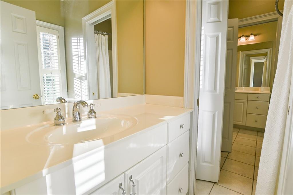 55 Glengarry Chase Covington, GA 30014 - Photo 32 of 73 a bathroom with a granite countertop sink and a mirror