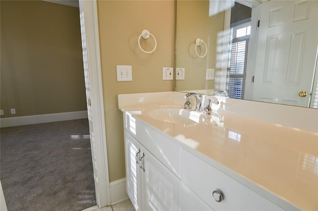 55 Glengarry Chase Covington, GA 30014 - Photo 33 of 73 a bathroom with a sink a mirror and a shower