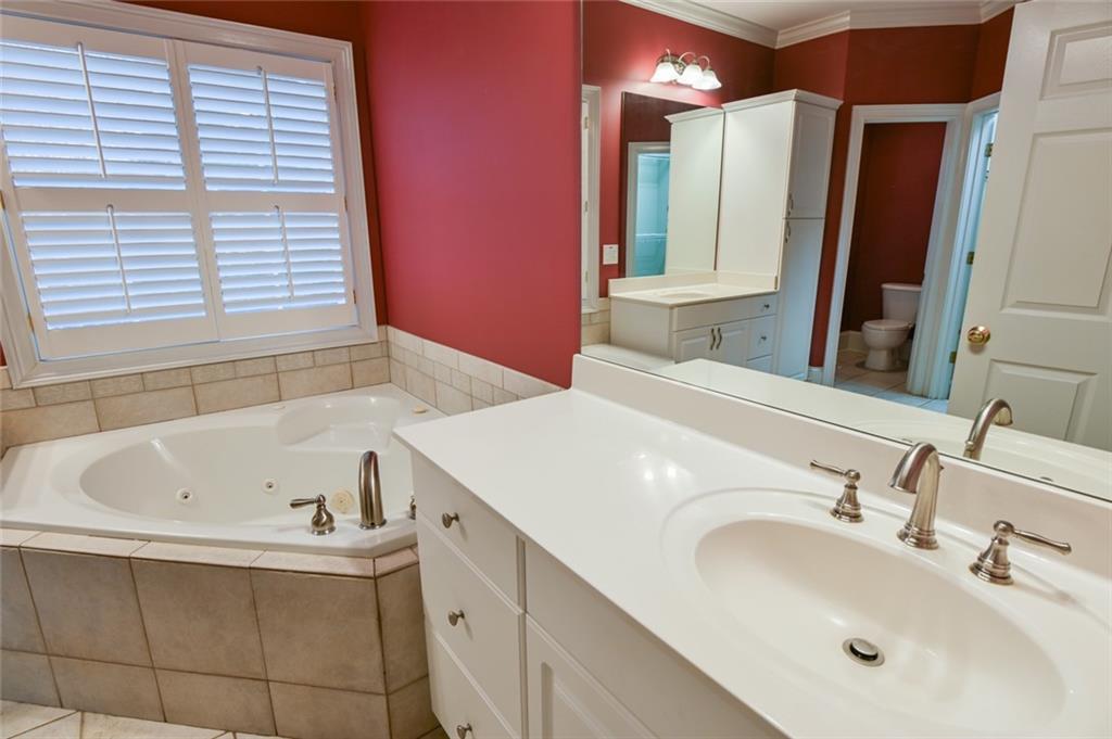 55 Glengarry Chase Covington, GA 30014 - Photo 41 of 73 a bathroom with a bathtub and a sink
