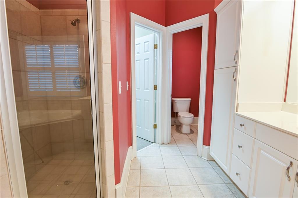 55 Glengarry Chase Covington, GA 30014 - Photo 43 of 73 a bathroom with a granite countertop shower and a sink