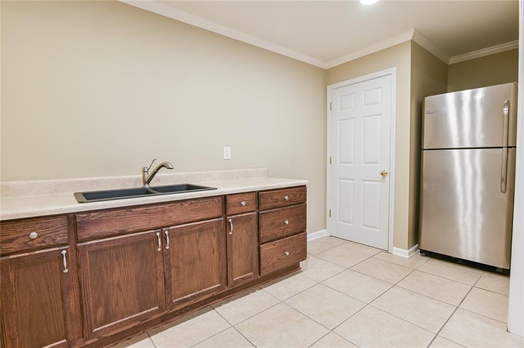 55 Glengarry Chase Covington, GA 30014 - Photo 50 of 73 a kitchen with stainless steel appliances granite countertop a refrigerator and a sink