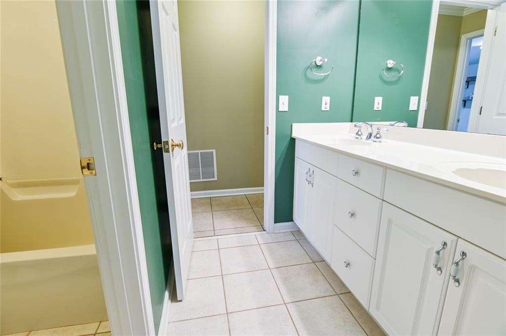 55 Glengarry Chase Covington, GA 30014 - Photo 60 of 73 a bathroom with a shower and a sink