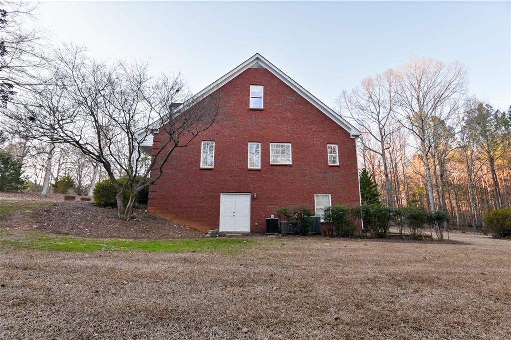 55 Glengarry Chase Covington, GA 30014 - Photo 66 of 73 a front view of a house with a yard