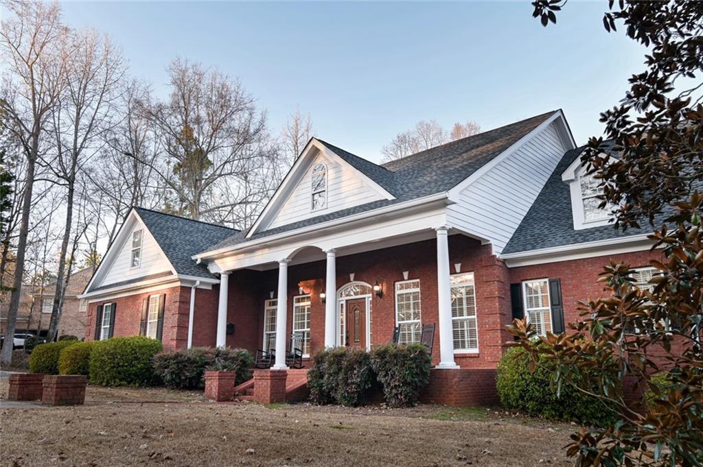 55 Glengarry Chase Covington, GA 30014 - Photo 67 of 73 a front view of a house with garden