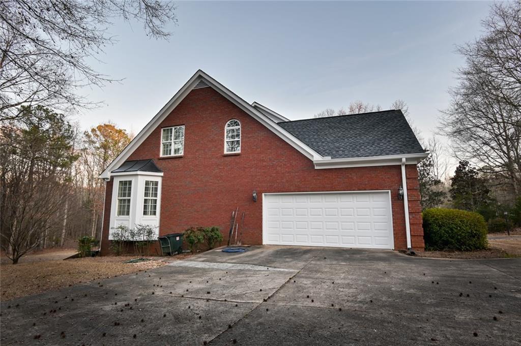 55 Glengarry Chase Covington, GA 30014 - Photo 69 of 73 a front view of a house with a yard and garage