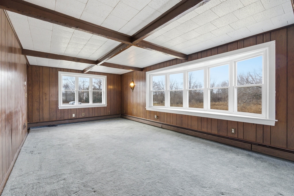 198 Conant Street Danvers, MA 01923 - Photo 13 of 32 an empty room with wooden floor and windows