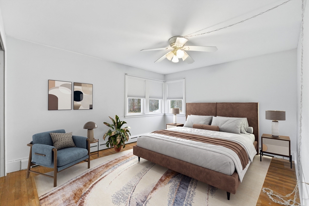 198 Conant Street Danvers, MA 01923 - Photo 14 of 32 a bedroom with a bed couch and a window