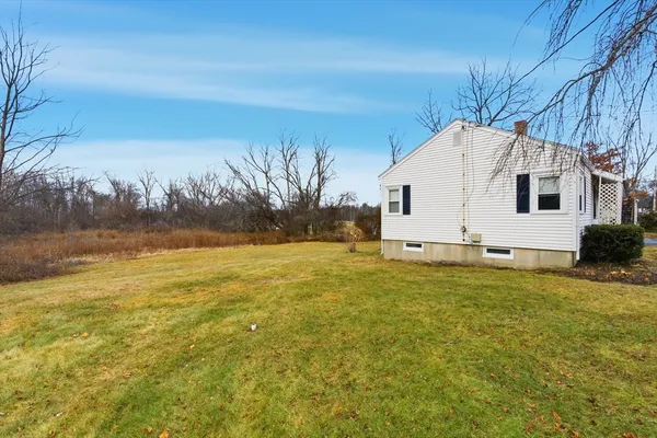 a view of a house with a yard