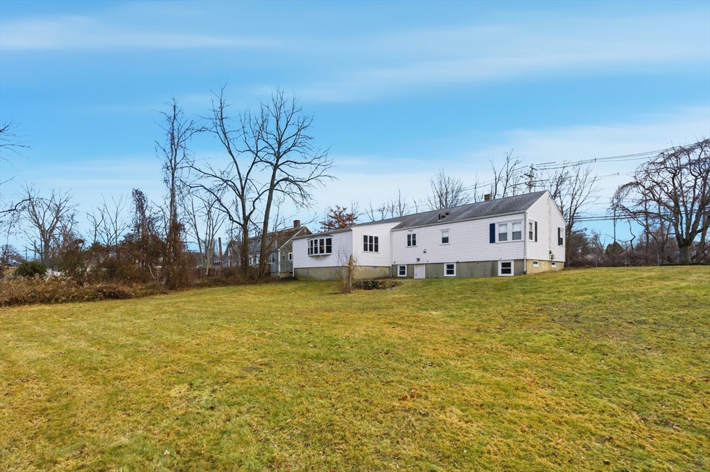198 Conant Street Danvers, MA 01923 - Photo 29 of 32 a view of a lake with a house in the background