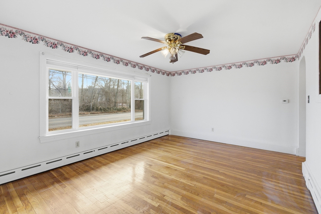 198 Conant Street Danvers, MA 01923 - Photo 4 of 32 a view of a room with wooden floor fan and windows