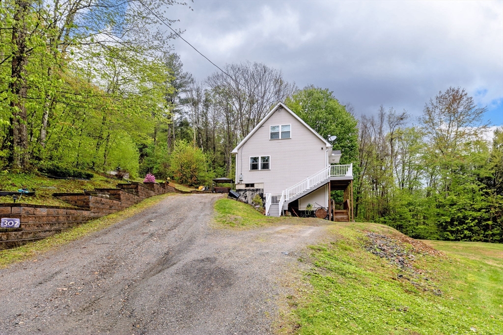 302 Middlefield Road Chester, MA 01011 - Photo 38 of 42 a view of a house with a yard