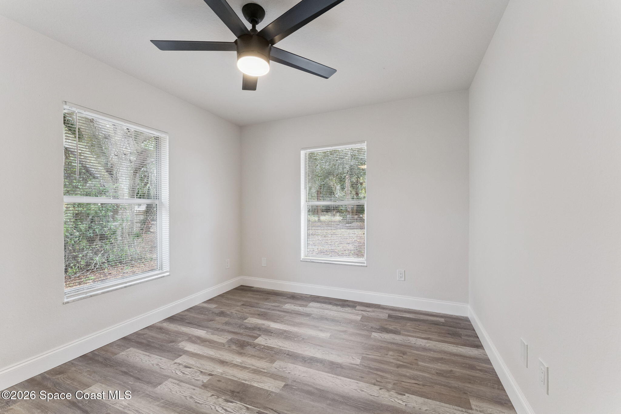 2665 Myrtle Avenue Mims, FL 32754 - Photo 12 of 23 a view of an empty room with a window