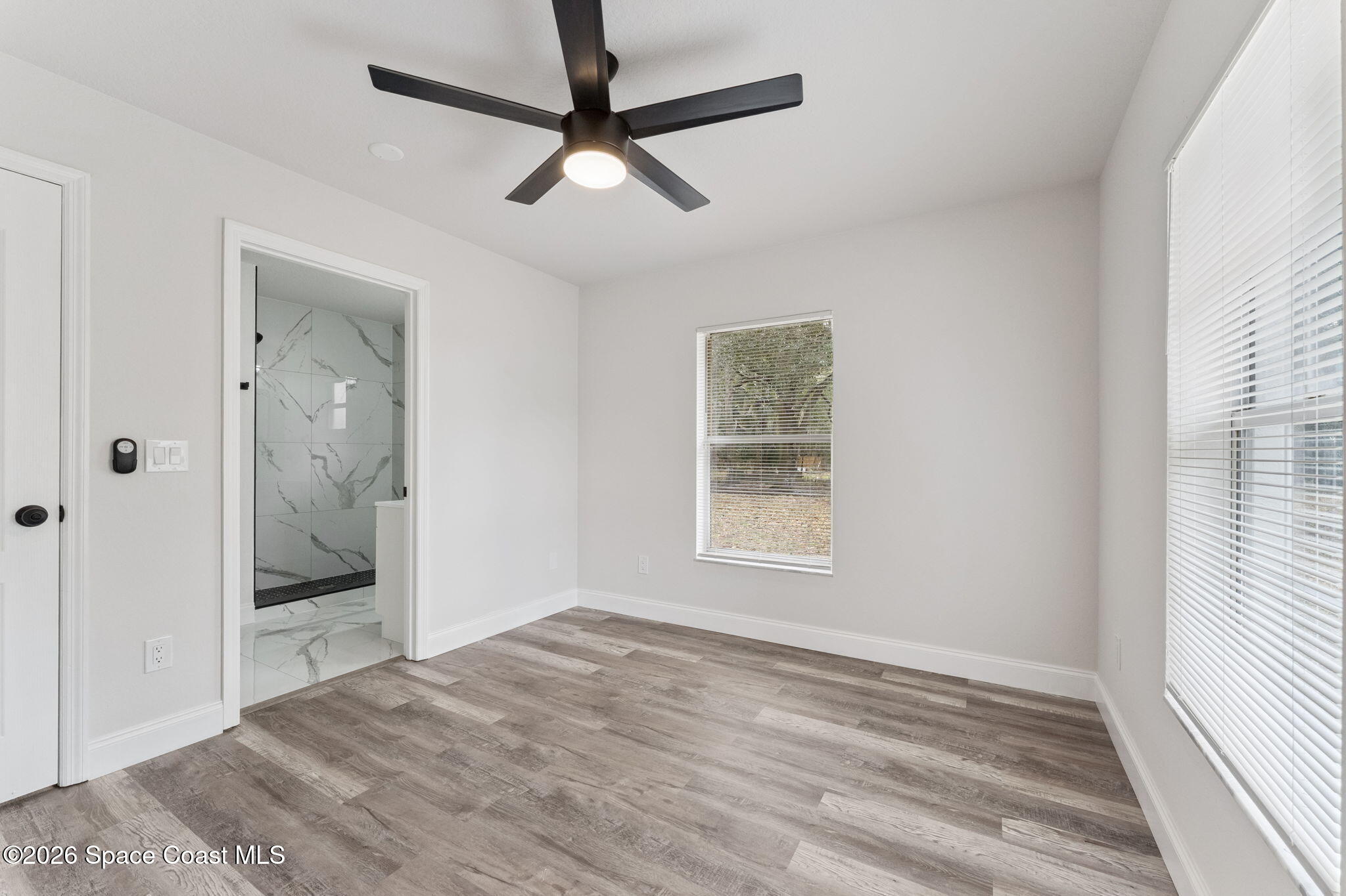 2665 Myrtle Avenue Mims, FL 32754 - Photo 15 of 23 an empty room with fan and windows