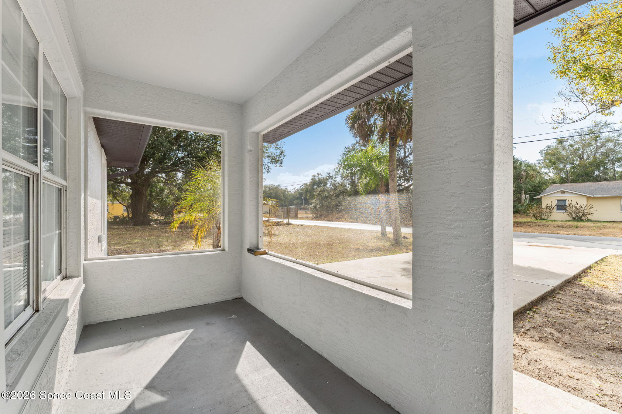 2665 Myrtle Avenue Mims, FL 32754 - Photo 2 of 23 a view of an empty room and window