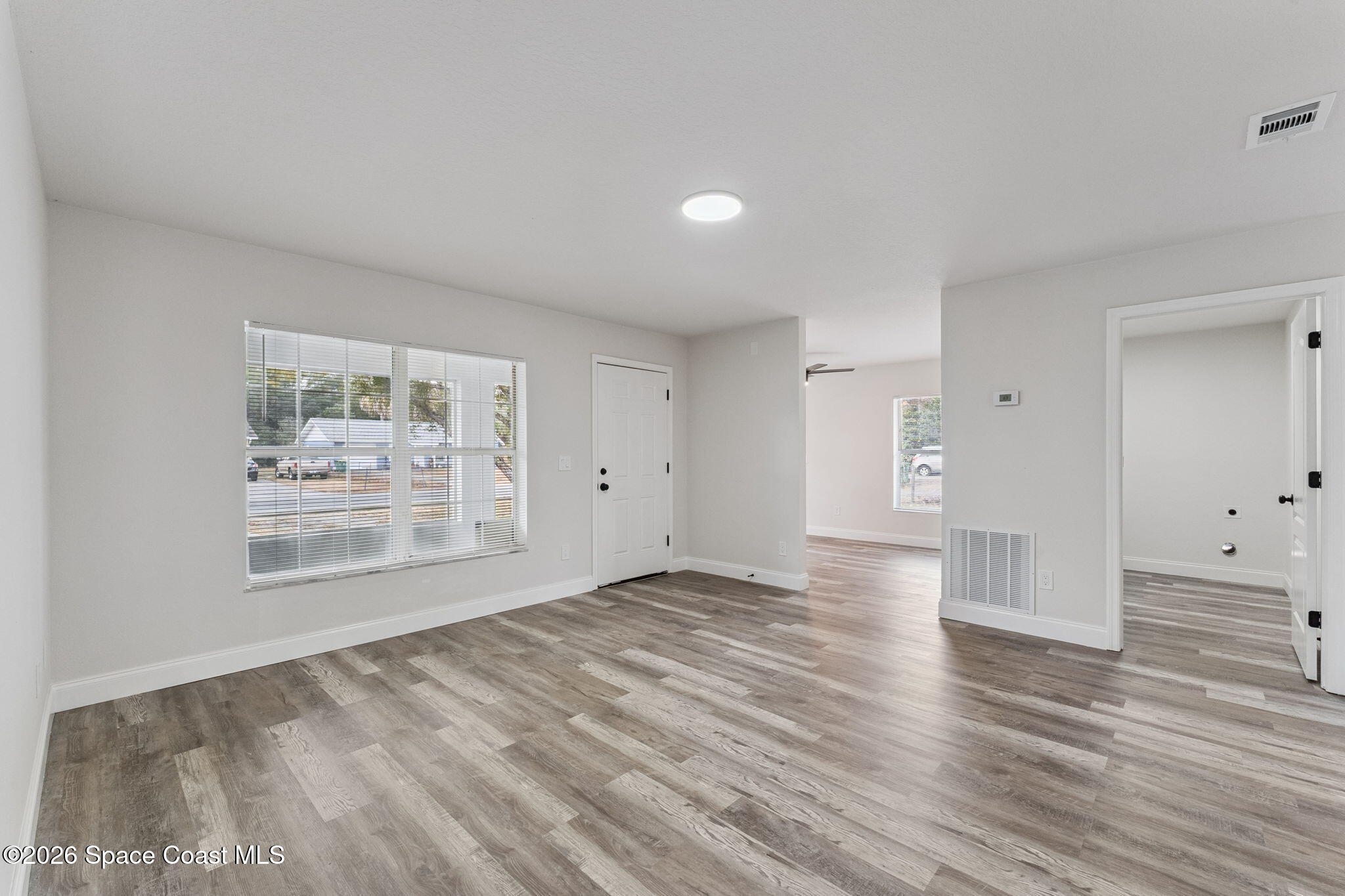 2665 Myrtle Avenue Mims, FL 32754 - Photo 4 of 23 a view of empty room with wooden floor
