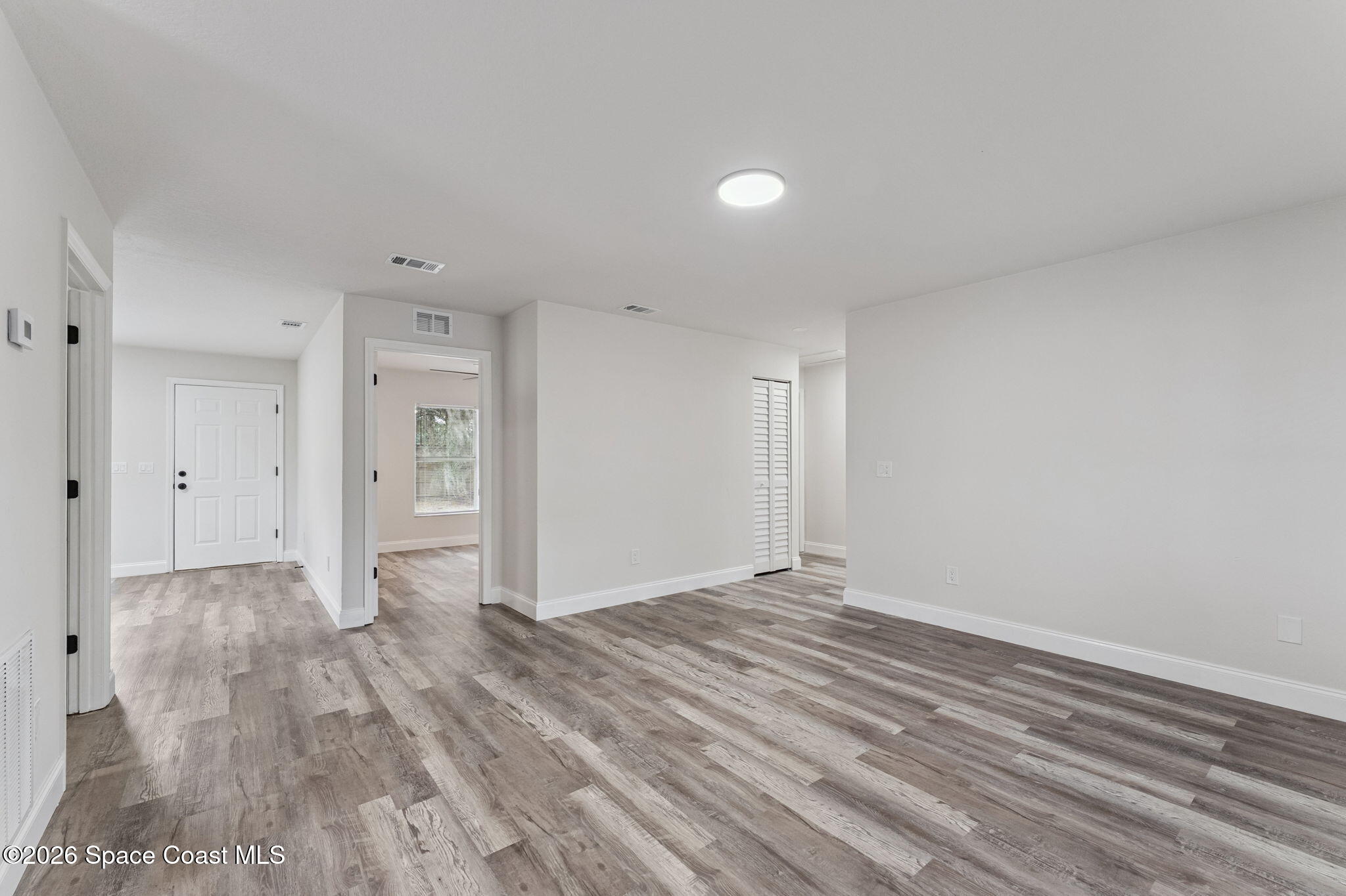 2665 Myrtle Avenue Mims, FL 32754 - Photo 5 of 23 a view of empty room with wooden floor