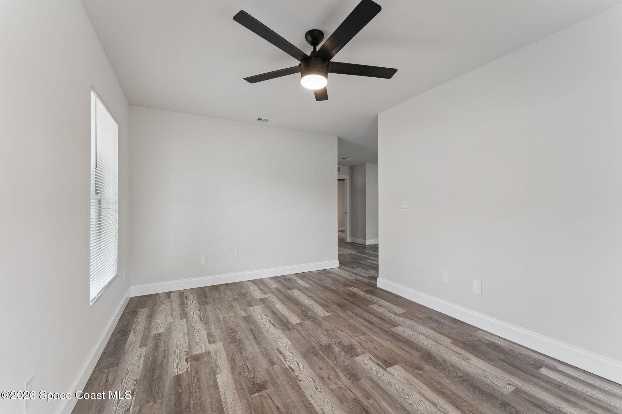2665 Myrtle Avenue Mims, FL 32754 - Photo 10 of 23 wooden floor in an empty room