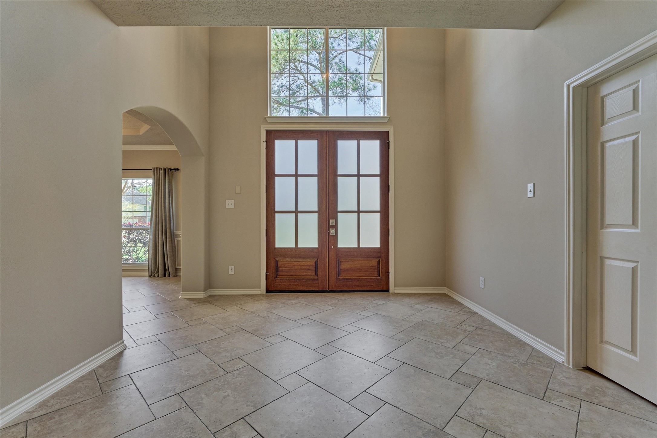 30202 West Legends Trail Drive Spring, TX 77386 - Photo 14 of 50 A view of the front double entry doors. To the left is the formal dining which also has direct access to the kitchen.The large windows in the home allows all the natural light in.