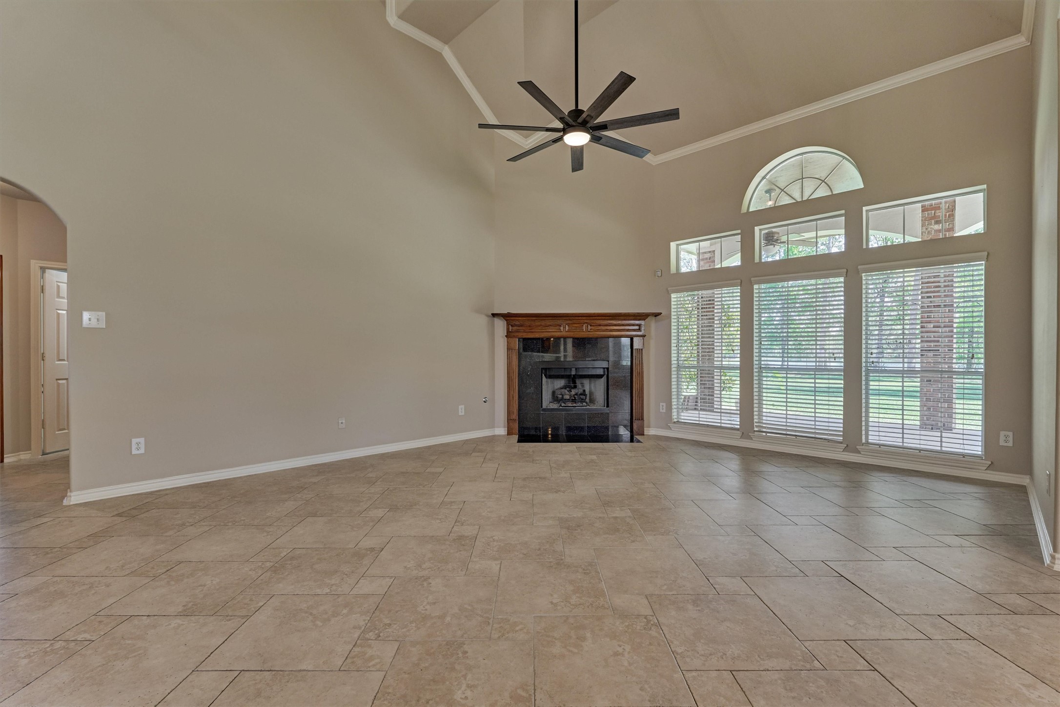 30202 West Legends Trail Drive Spring, TX 77386 - Photo 16 of 50 The living area with soaring ceilings, large windows and a corner fireplace.