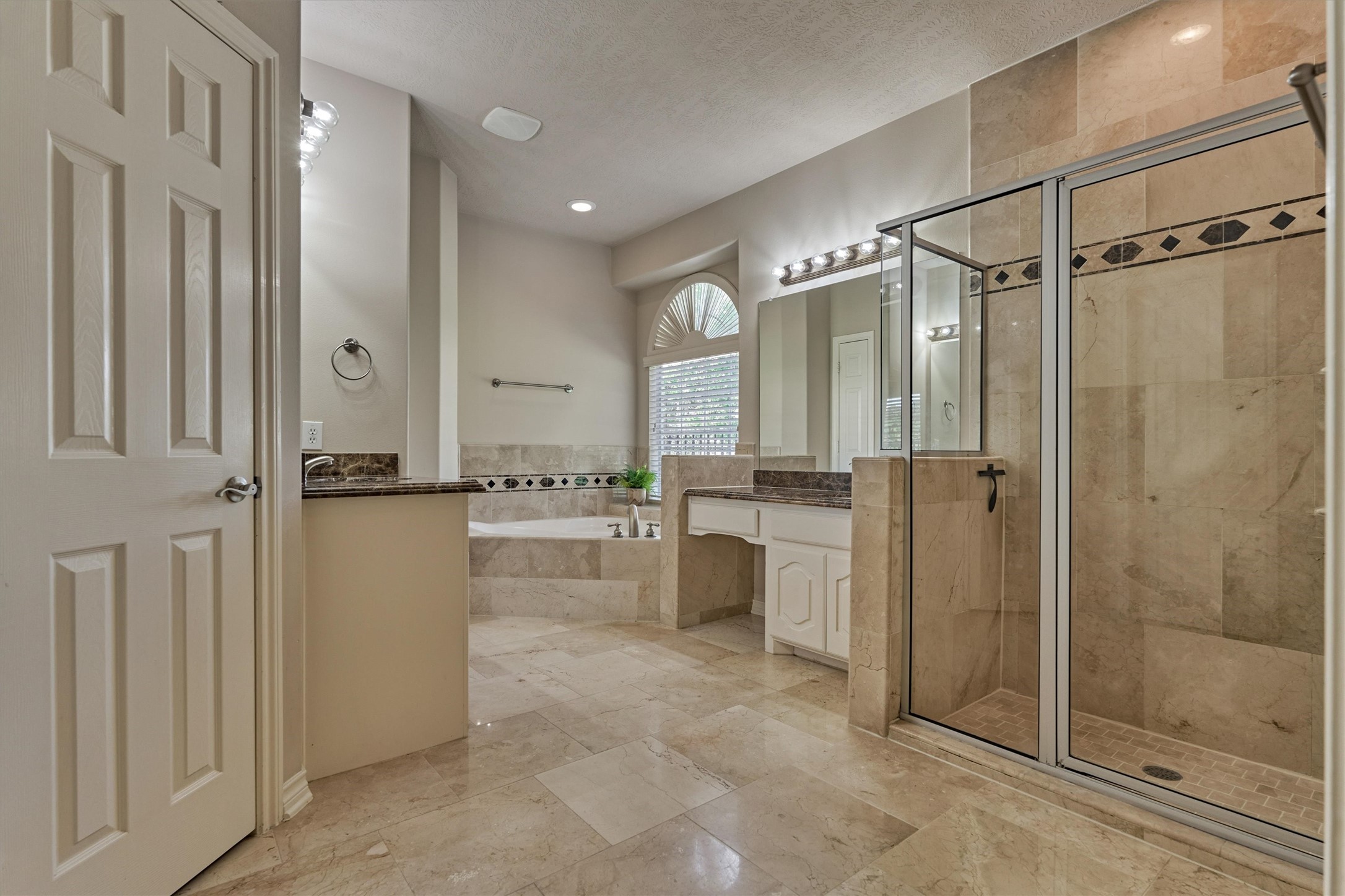 30202 West Legends Trail Drive Spring, TX 77386 - Photo 29 of 50 The large en-suite primary bathroom. A large walk in shower, dual vanity areas, and a large soaker tub.