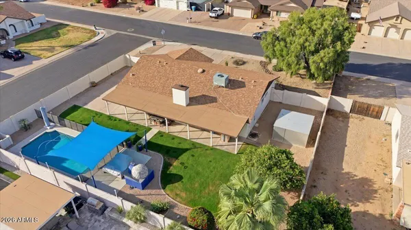 an aerial view of a house a yard and lake view