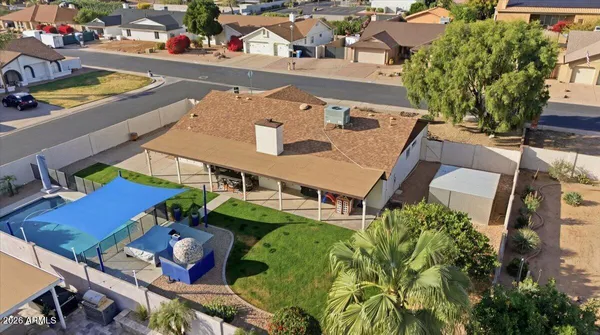 an aerial view of a house with a ocean view