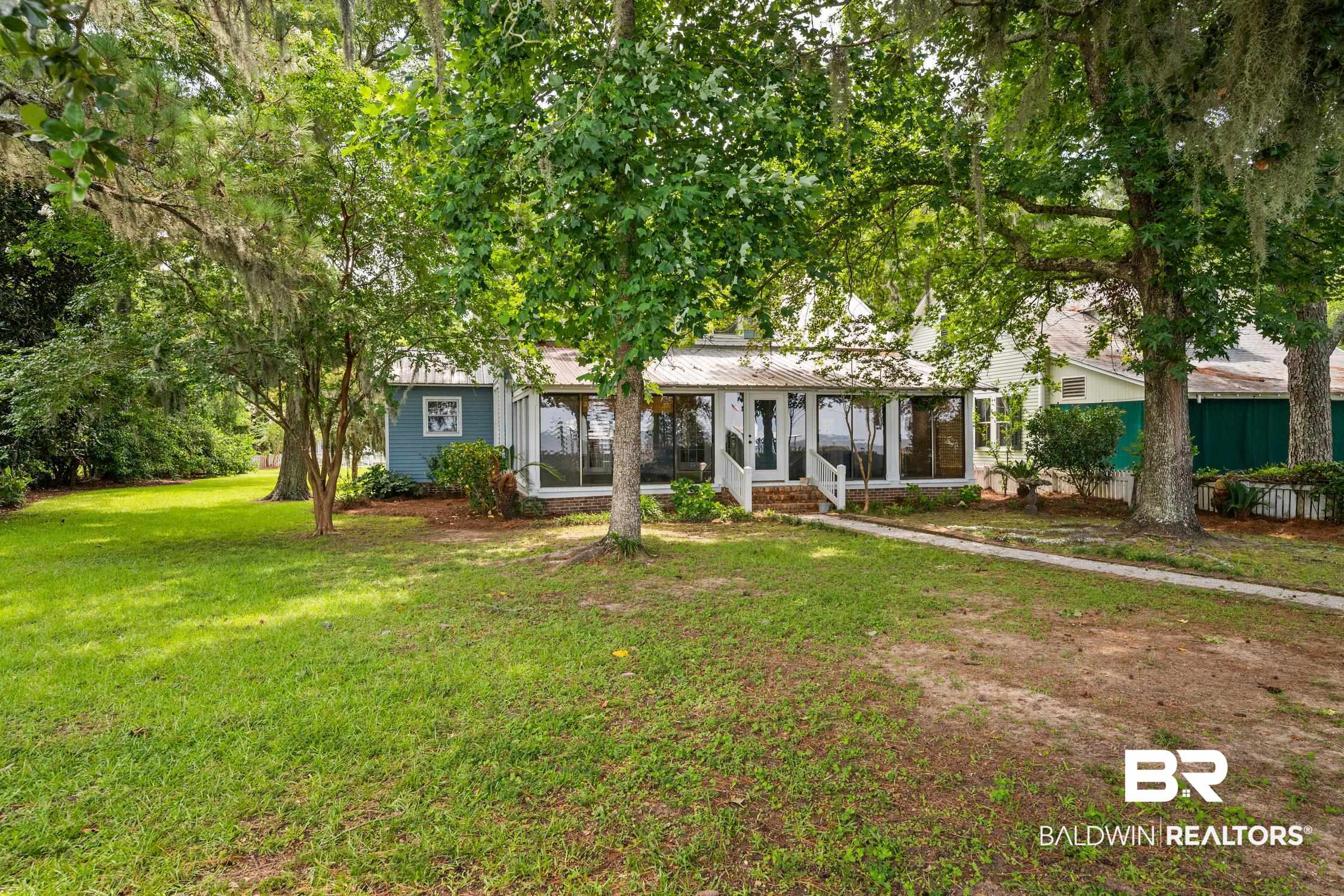 5490 Battles Road Fairhope, AL 36532 - Photo 6 of 47 Expansive front yard featuring mature trees and a manicured lawn