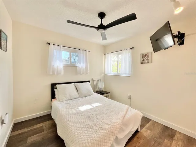 a bedroom with furniture and a chandelier