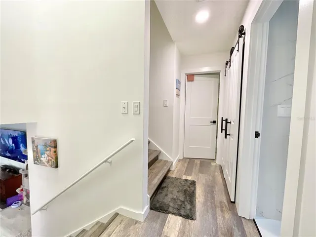 a spacious bathroom with a double vanity sink mirror and a bathtub