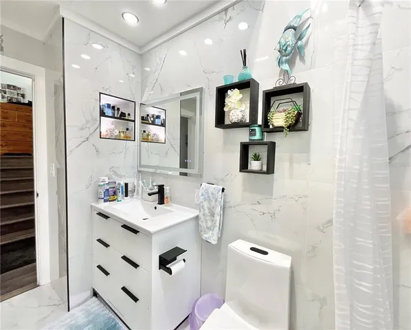 a bathroom with a shower and toilet