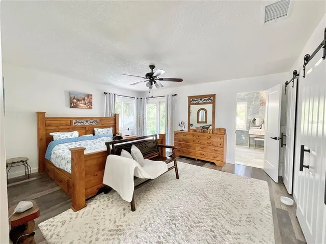 a room with patio furniture and a potted plant