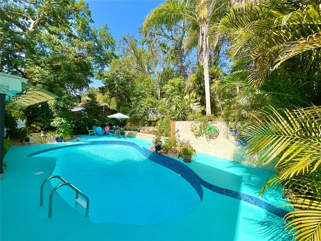 a view of a lake with houses in the back