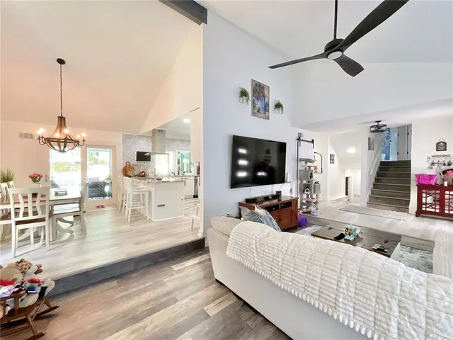 a kitchen with stainless steel appliances kitchen island granite countertop a sink and cabinets