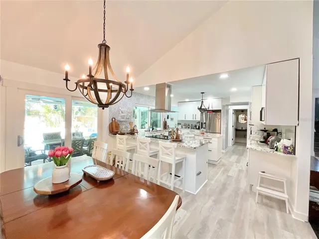 a kitchen with a stove a sink and a refrigerator
