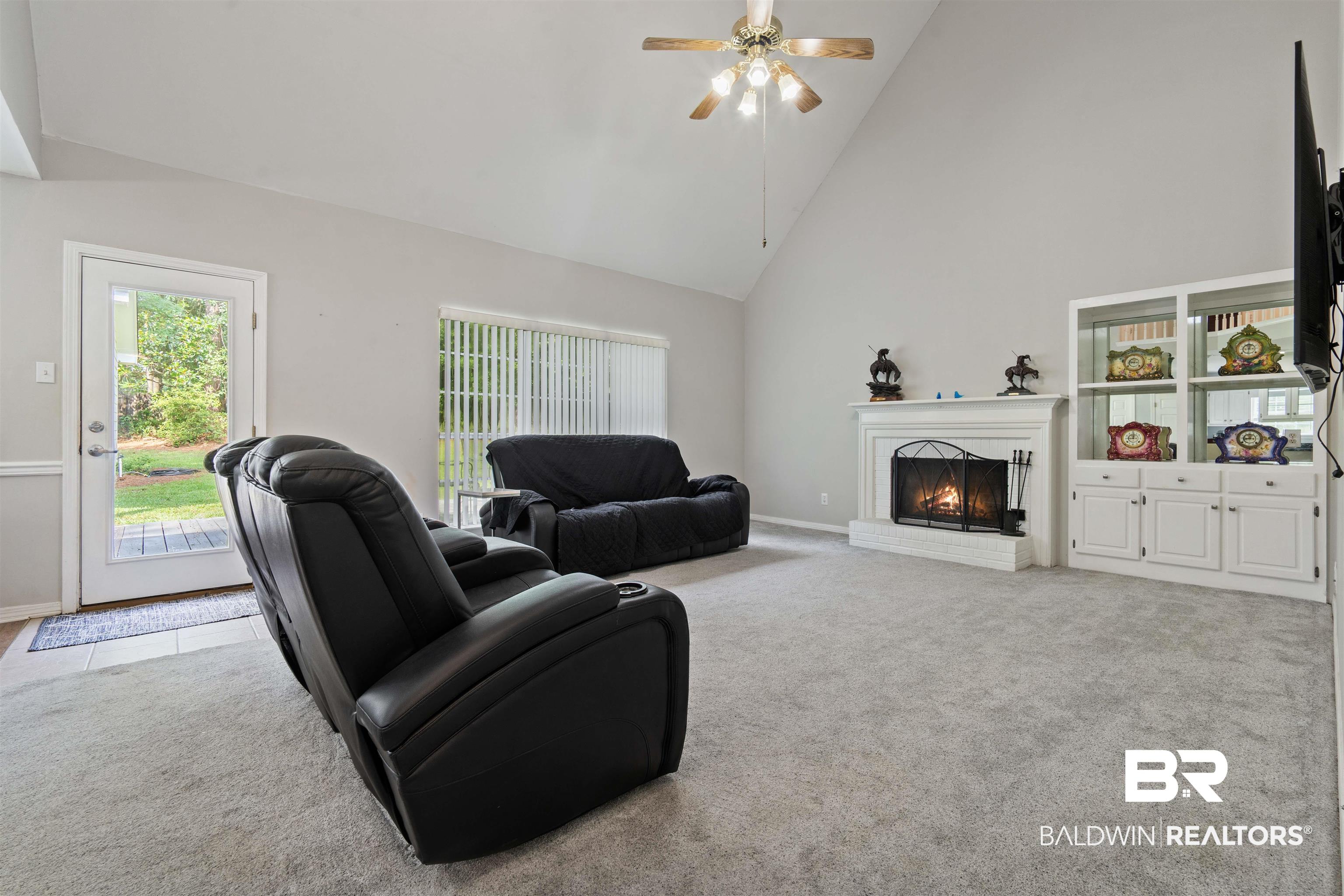 6457 Double Tree Court Mobile, AL 36695 - Photo 15 of 37 Carpeted living room with high vaulted ceiling and ceiling fan