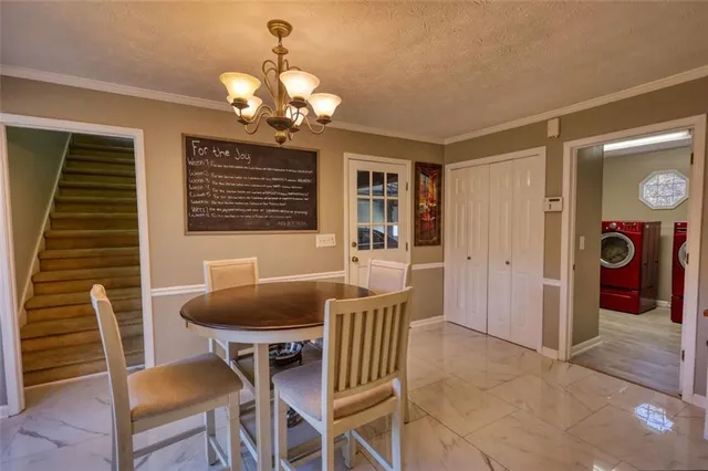a kitchen with granite countertop a stove sink and cabinets