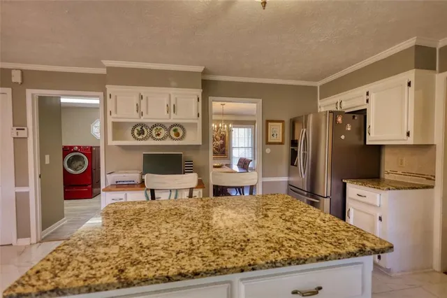 a living room with furniture ceiling fan and a window